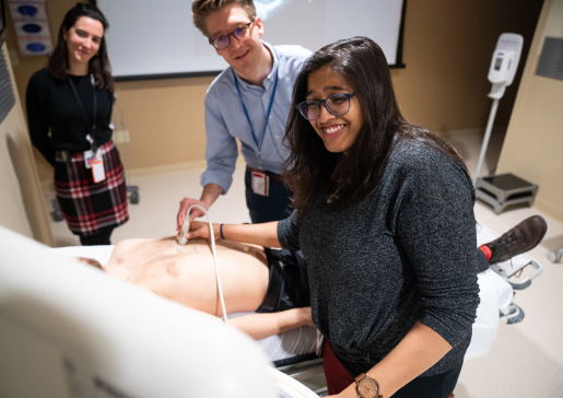 University of Wisconsin internal medicine residents perform an ultrasound on a fellow trainee as part of the Point-of-Care Ultrasound (POCUS) course 