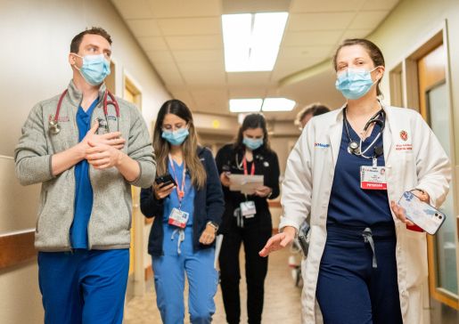 Internal medicine residents walking together in a hallway of University Hospital