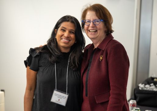 Drs. Sumona Saha and Lynn Schnapp smile together at a department event