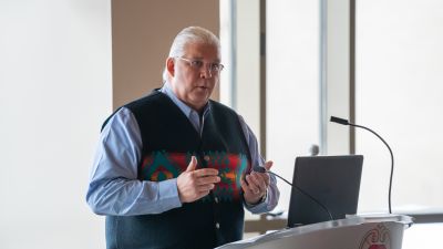 Bret Benally Thompson, MD, associate clinical professor, speaks at a public event.