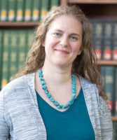 a portrait of Dr. Liana Eskola in a library