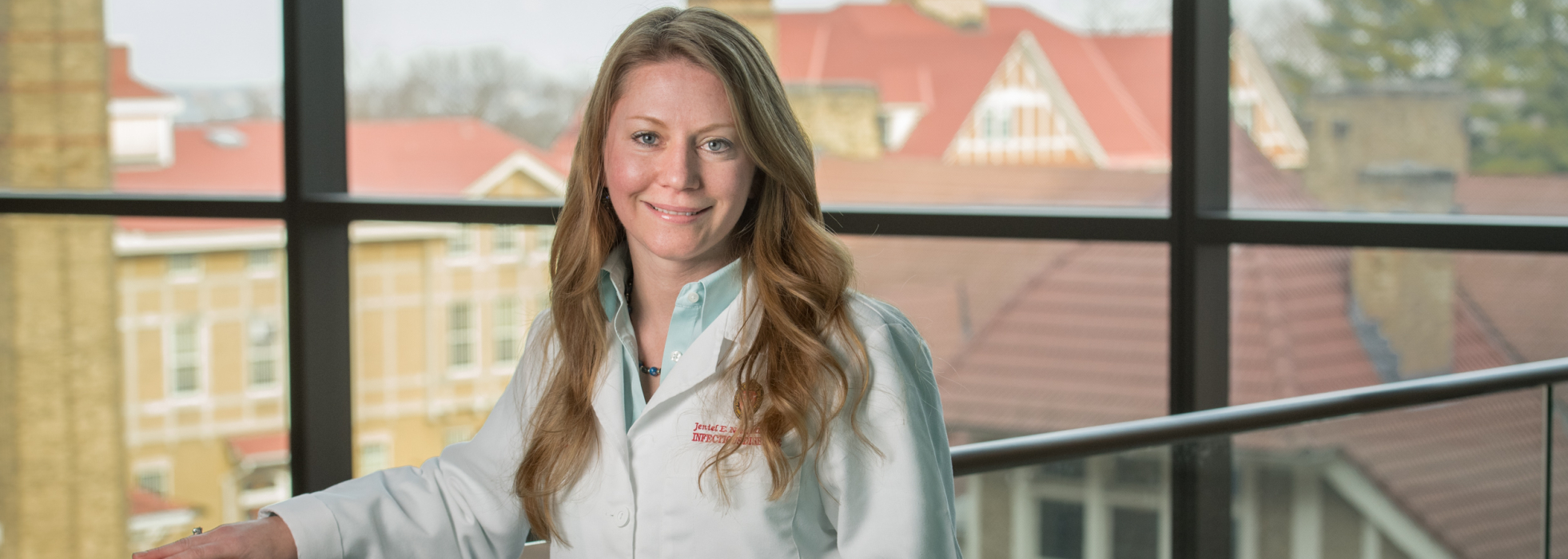 photo of Dr. Nett by a window on the UW-Madison campus