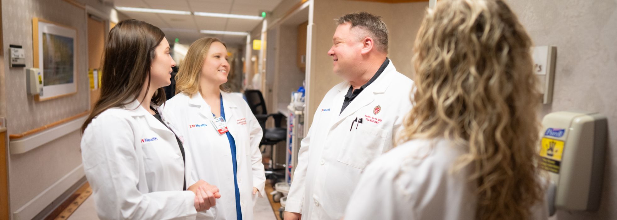 The lung transplant team talking in a hallway