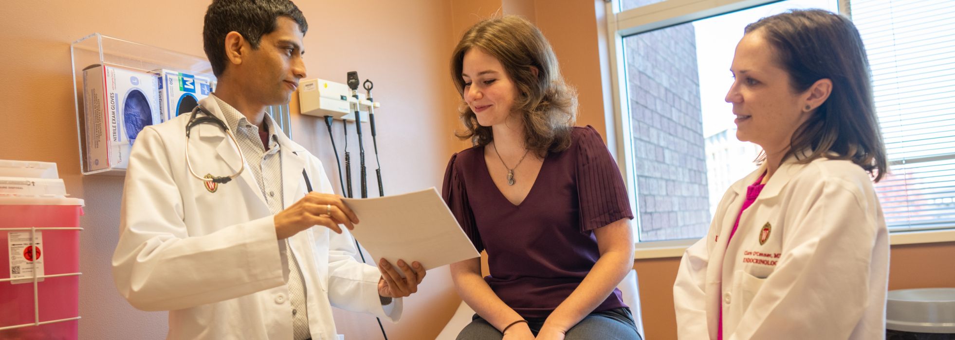 Doctors Georgia Zarola, and Suresh Paudel reviewing information