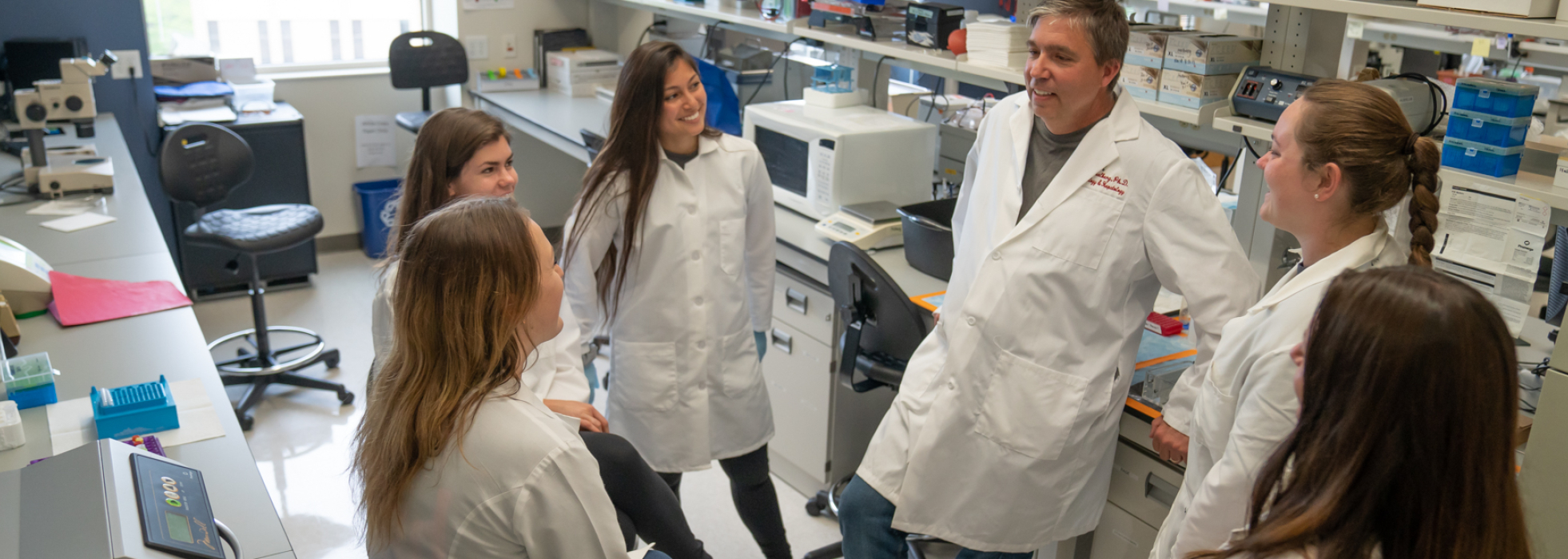 Dr. Richard Halberg in the lab with his research team