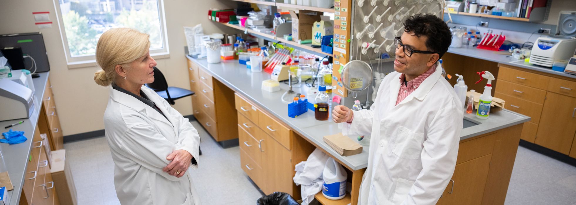 Dr. Freddy Caldera talking in the lab