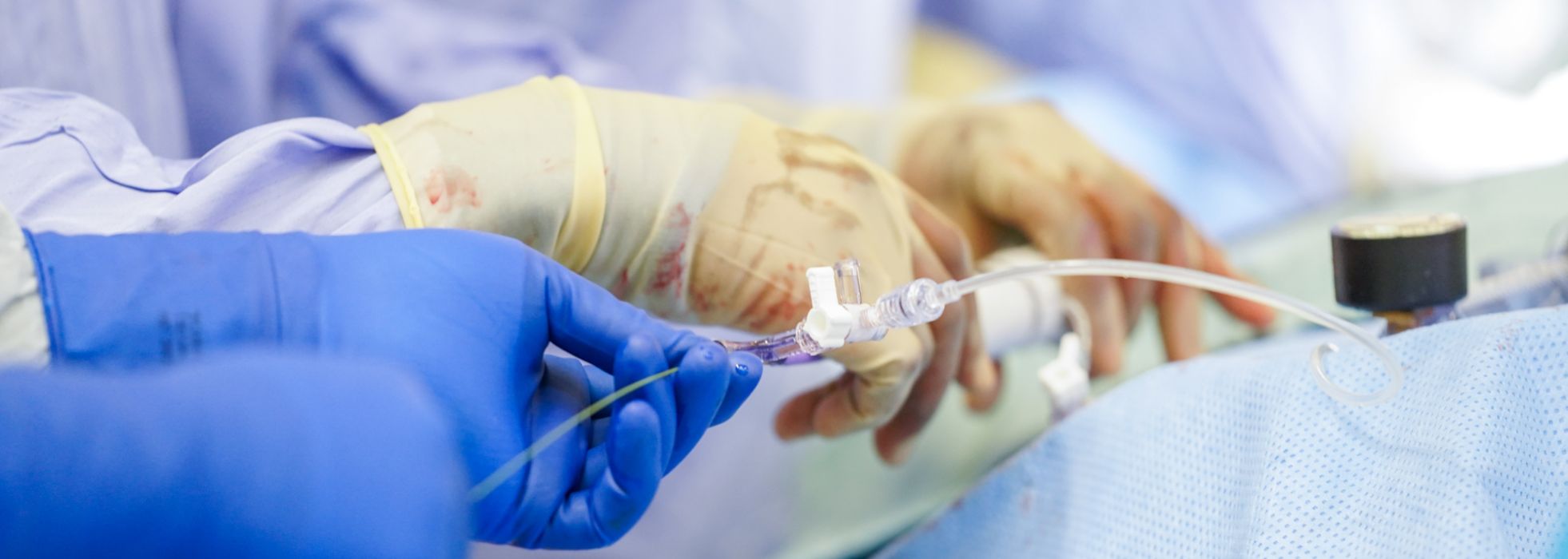 Closeup of interventional cardiologists' hands in the cath lab