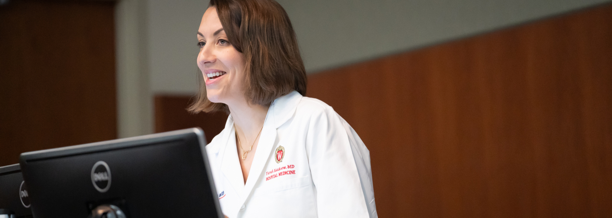 Dr. Farah Kaiksow at the podium giving a presentation at a Department of Medicine Research Day