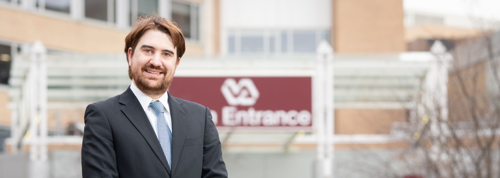 Photo of Dr. Aaron Kuntz outside of the William S. Middleton VA Hospital 