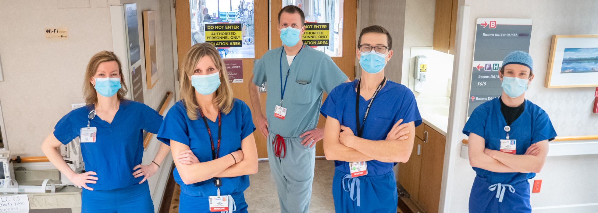 Hospital medicine faculty in front of ICU