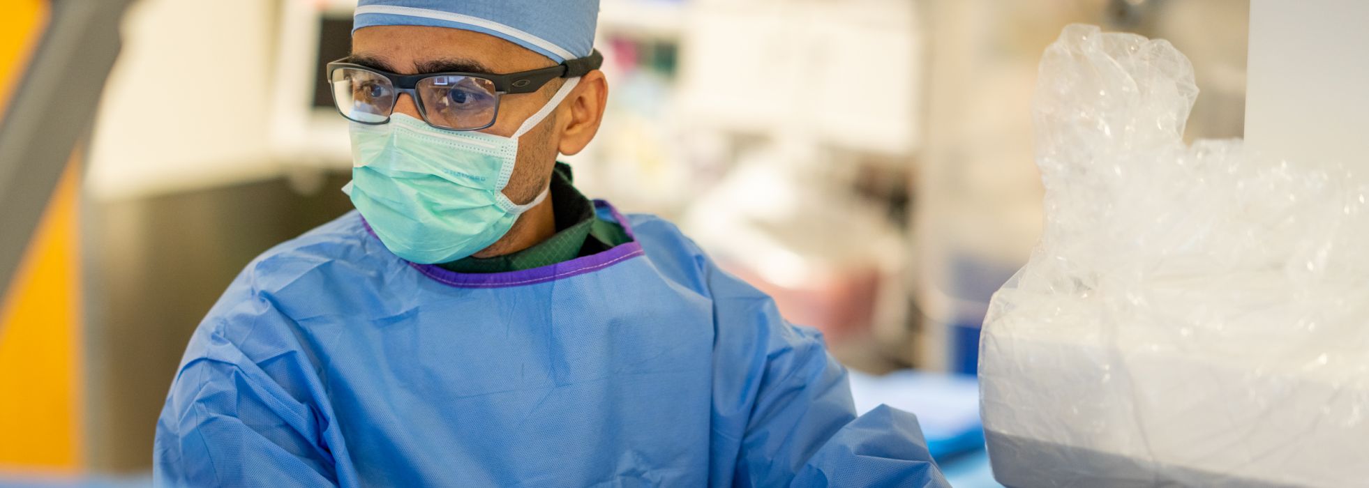 Dr. Farhan Raza working in the cath lab at University Hospital