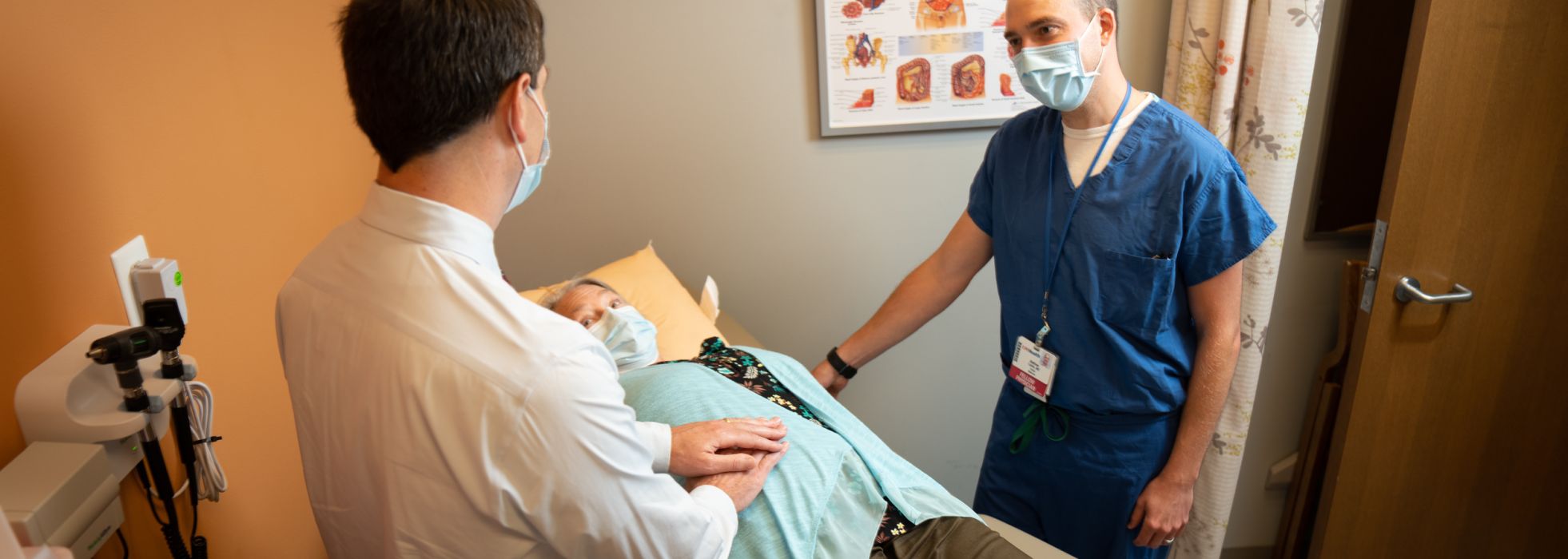 Dr. Ian Grimes and GI fellow Dr. Matt Caldis in clinic