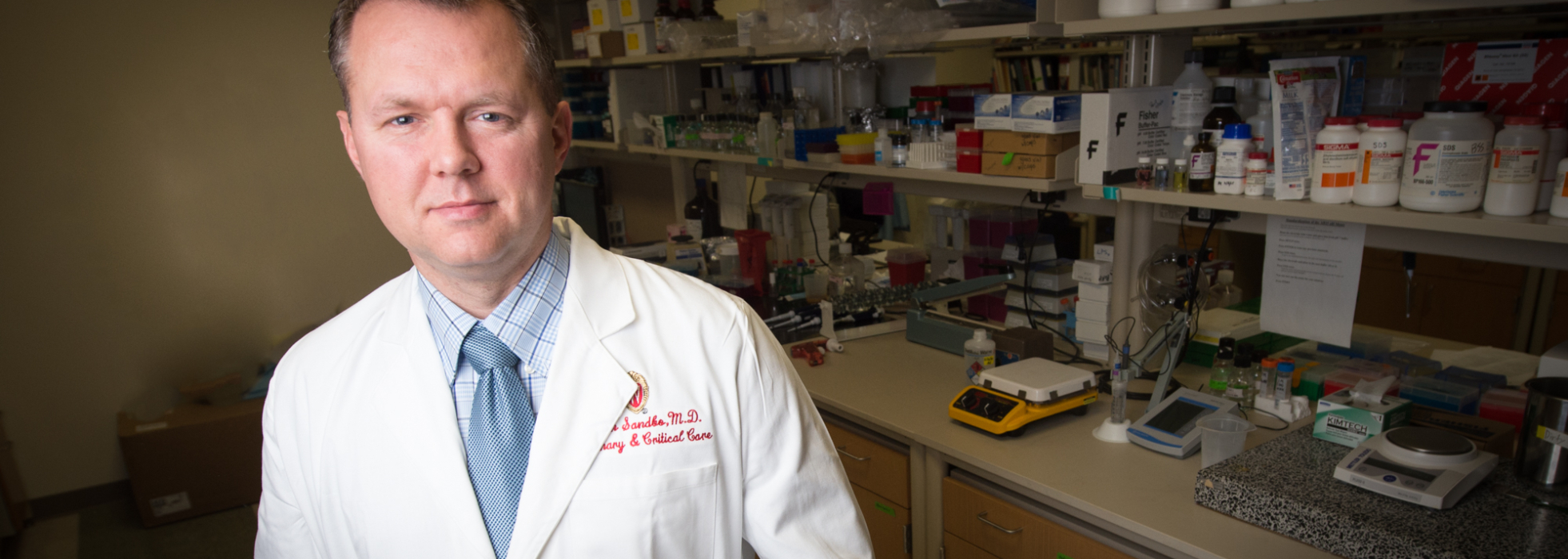 photo of Dr. Nathan Sandbo in his lab