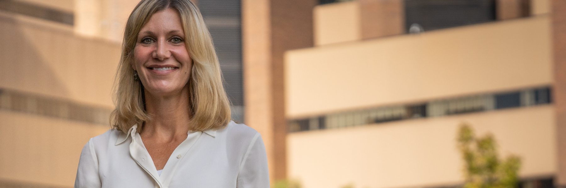 photo of Dr. Ann Sheehy in front of University Hospital
