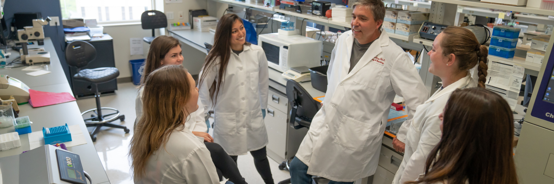 Dr. Richard Halberg in the lab with his research team