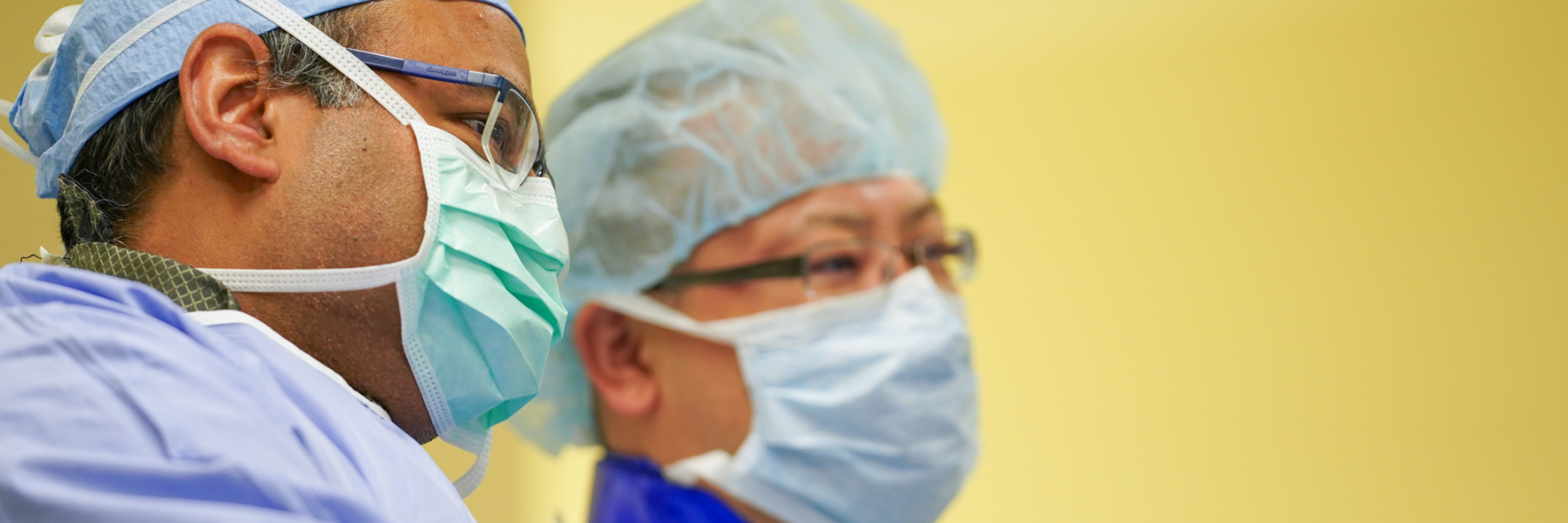 Physicians talking to one another in the cath lab