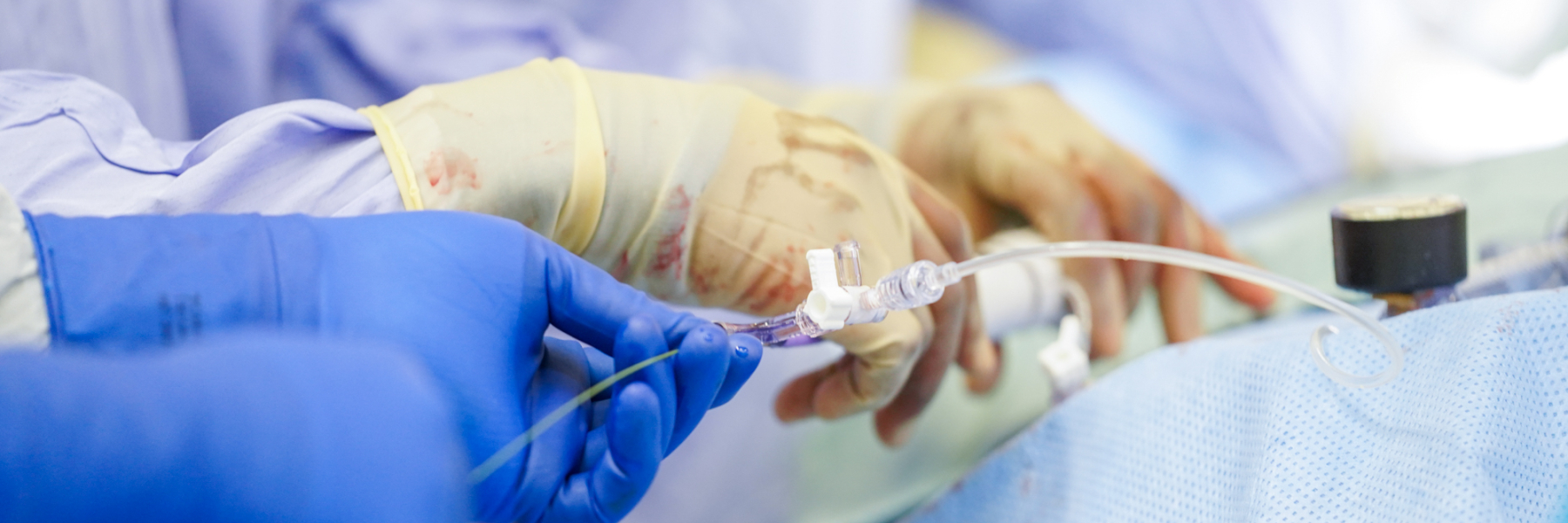 Closeup of interventional cardiologists' hands in the cath lab