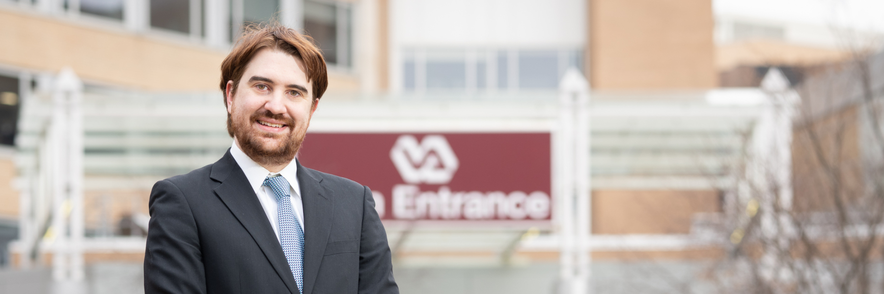 Photo of Dr. Aaron Kuntz outside of the William S. Middleton VA Hospital 