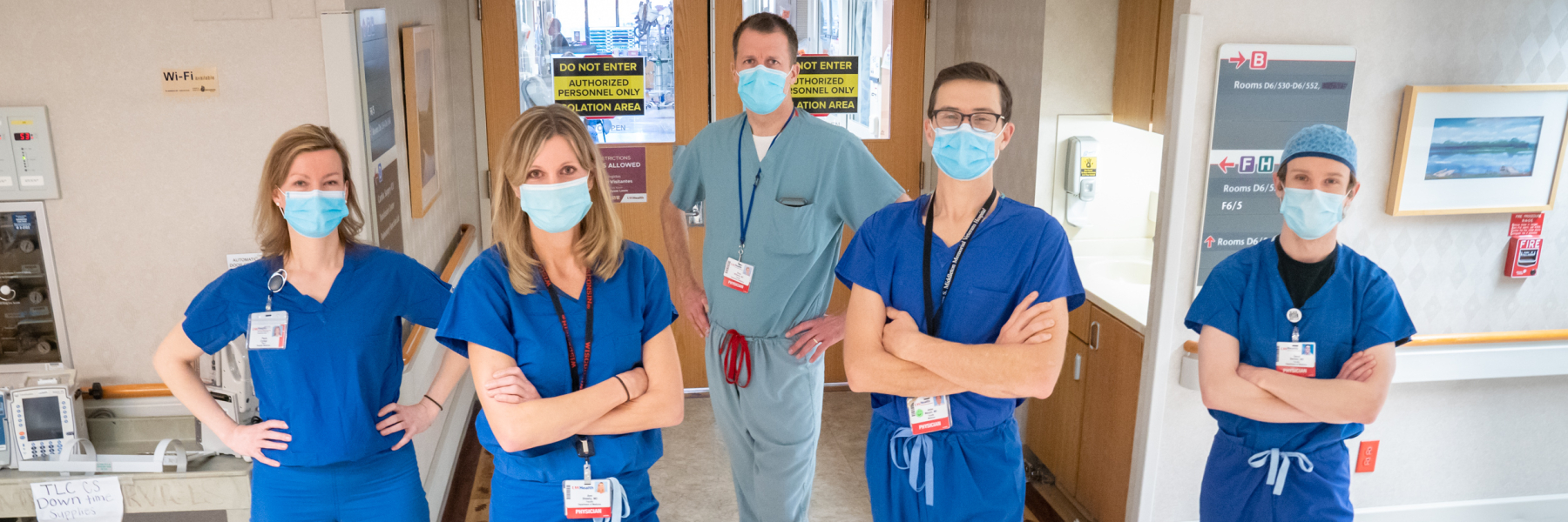 Hospital medicine faculty in front of ICU