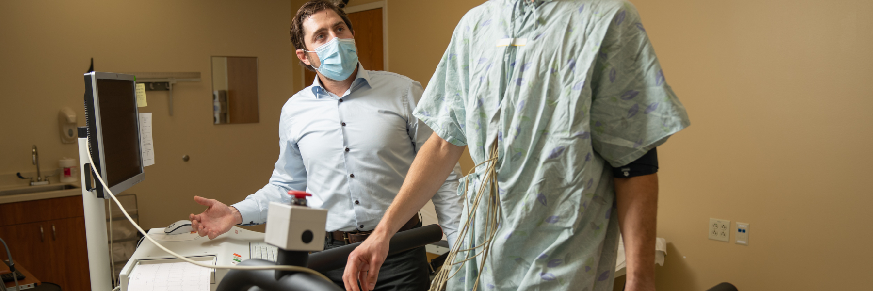 Adam Gepner works with a patient