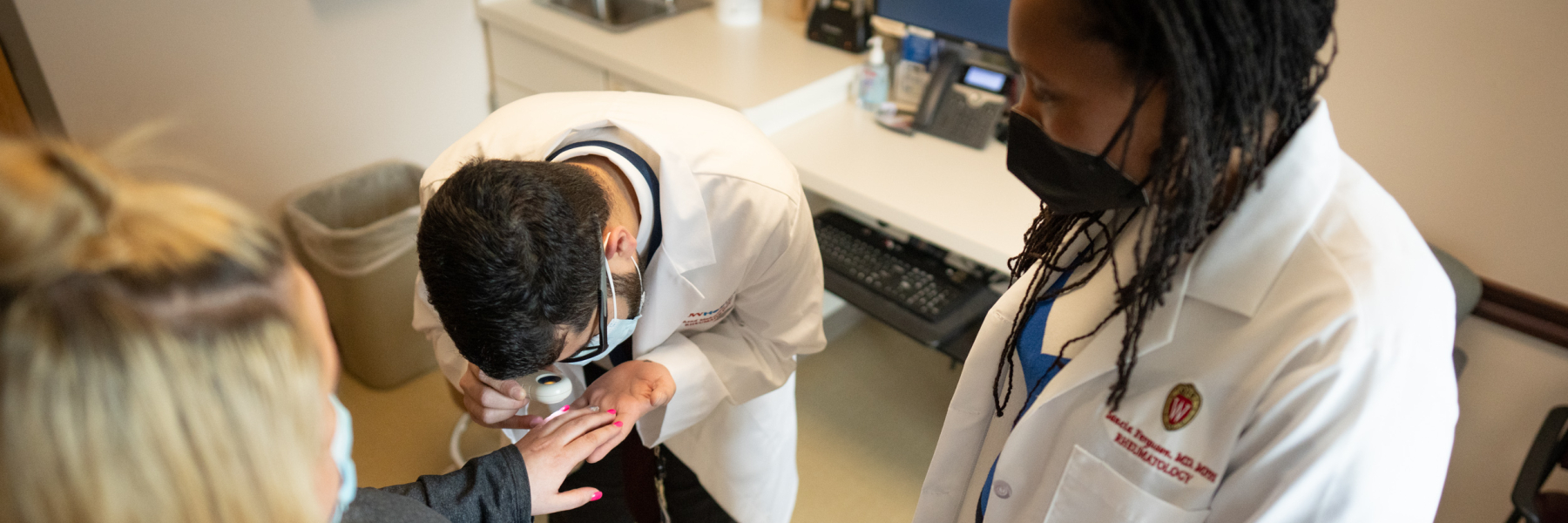 Dr. Sancia Ferguson and a rheumatology fellow in clinic