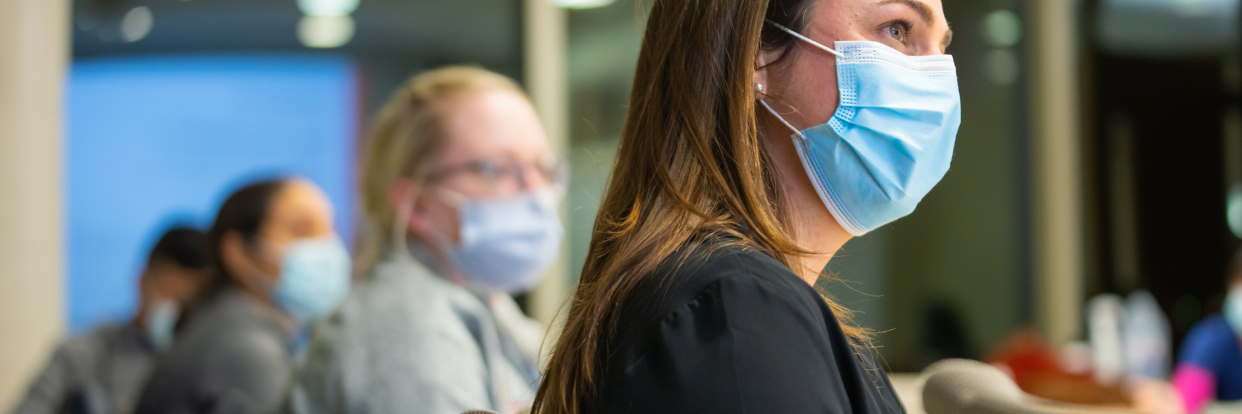Drs. Sarah Donohue and Dana Ley listen at a WILD session