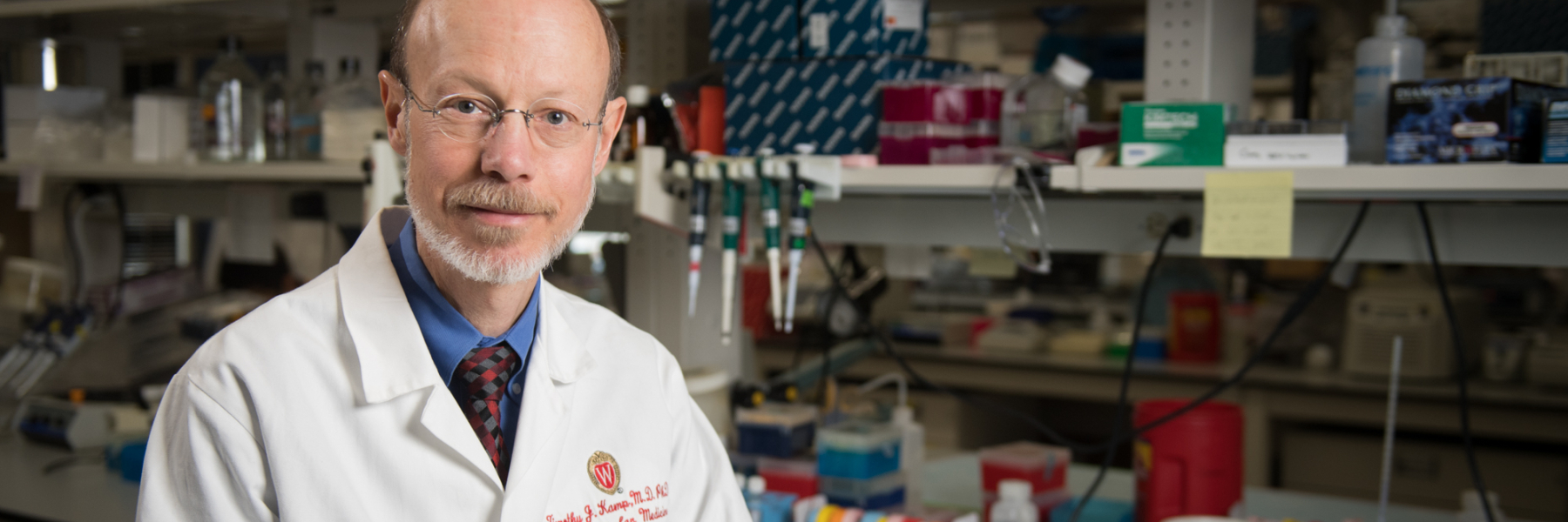 photo of Dr. Tim Kamp wearing white coat in his lab