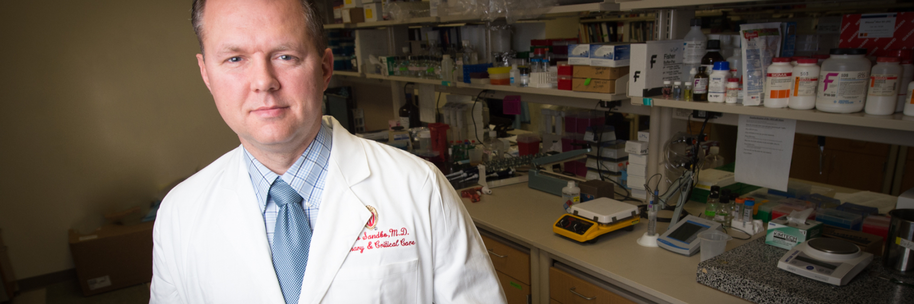 photo of Dr. Nathan Sandbo in his lab