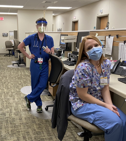 Internal medicine resident Matthew Folstad, MD, in the outpatient clinic with medical assistant Emily Steuber