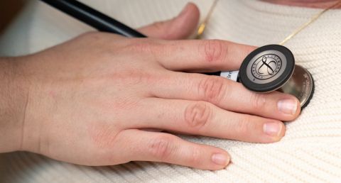 Physician and patient with stethoscope