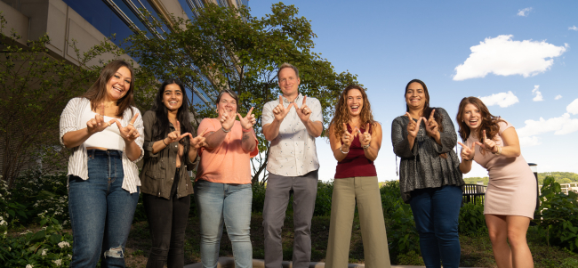 Dr. Lee Eckhardt's lab team making W sign