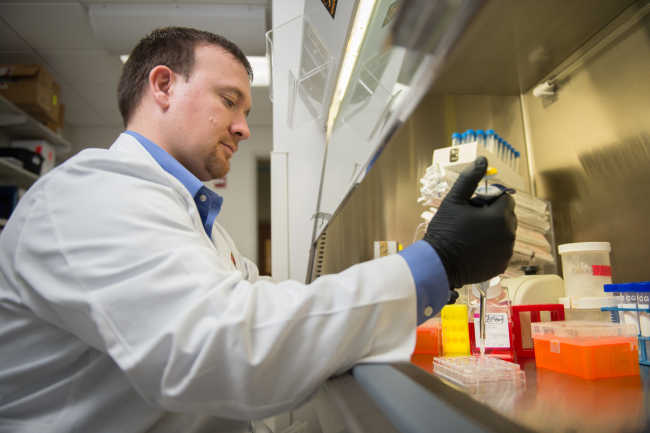 Dr. Dustin Deming in research laboratory