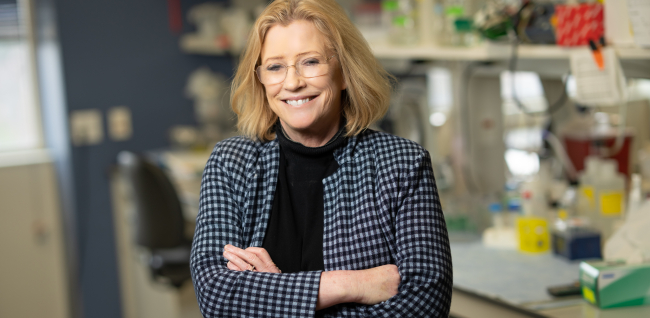 Dr. Shannon Kenney stands in her lab