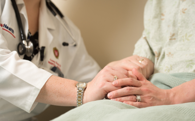 Inpatient scene with physician and patient