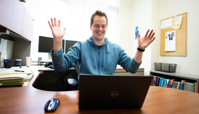 Internal medicine residency program director Dr. Andy Coyle reacts to match results on the computer on his desk