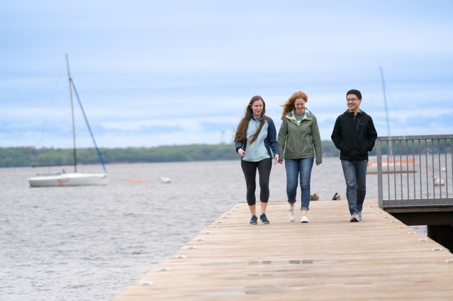 Graduating 2023 internal medicine residents Amy Bier, MD, Ivana Surjancev, MD, and Ran Tao, MD, enjoy a quiet moment by Lake Mendota. Credit: Clint Thayer/Department of Medicine.