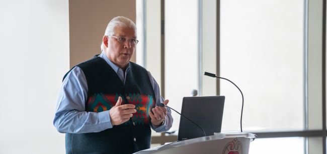 Bret Benally Thompson, MD, associate clinical professor, speaks at a public event.