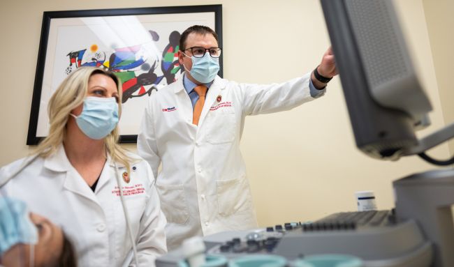 Dr. Tattersall (center) in the University of Wisconsin Atherosclerotic Imaging Research Program (AIRP) lab with AIRP associate lab manager Kristin Hansen.