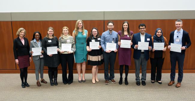 Left to right: DOM Vice Chair for Education Laura Zakowski, MD, poses with award recipients Christine Sharkey, MD; Jessica Tischendorf, MD, MS; Kelly Lavin, MD; Elyse Harris, MD; Rachel Filipiak, MHA; Jordan Kenik, MD; Amanda Salm; Fahad Aziz, MD; Maryam Zamanian, MD, MSc; and Ross Pinter, PA.