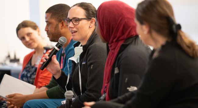 Left to right: Tess Woodring, MD, fellow, pediatric hematology/oncology; Akinwale Ikeyu, MD, MS, PG-1, internal medicine residency; Kelly Schmidt, MD, clinical assistant professor, Cardiovascular Medicine; Awa Sanneh, MD, PG-4, obstetrics and gynecology residency; Sarah Donohue, MD, assistant professor, Rheumatology. All five became new parents during their graduate medical training years. Here they answer questions during the panel portion of the “Fertility, Pregnancy, Parental Leave & Lactation Issues in 