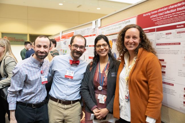 DOM faculty at the poster session, left to right: Daniel Rosenberg, MD, assistant professor, Allergy, Pulmonary and Critical Care Medicine; Trevor McKown, MD, assistant professor, Rheumatology; Tripti Singh, MBBS, associate professor, Nephrology; and Lindsay Taylor, MD, MS, assistant professor, Infectious Disease.