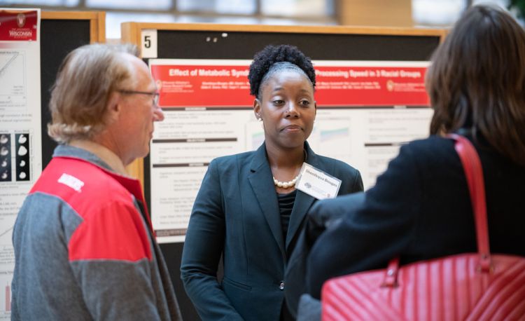 Photo of former VA Advanced Geriatrics fellow Dr. Sheniqua Bouges at a research poster session