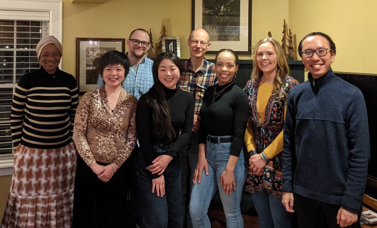 group photo of Dr. Tim Kamp's research team at a house gathering