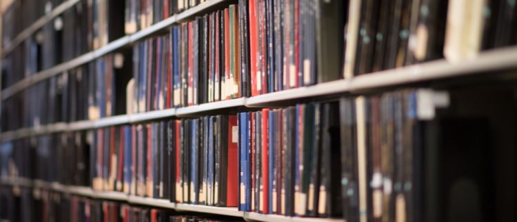 library shelves with journals and books