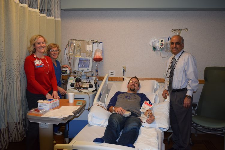 Lauren Racki, BMT patient coordinator; Jan McMannes, clinical nurse specialist with the BMT program; Ben Sanderfoot, patient and Dr. Peiman Hematti, professor, Hematology, Medical Oncology and Palliative Care.