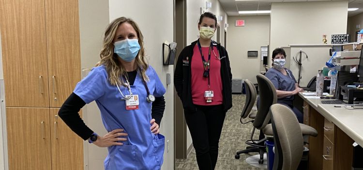 Briana Jelenc, MD, clinical assistant professor, General Internal Medicine, in the clinic with internal medicine resident Johanna Poterala, MD, and medical assistant Kathy Coppens.