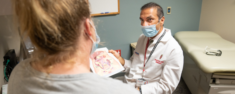 Dr. Sandesh Parajuli, Division of Nephrology, in conversation with a patient.
