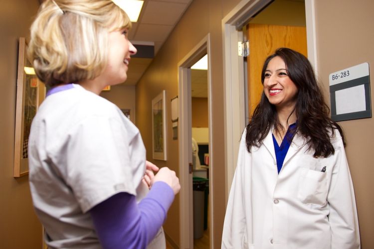 Dr. Nasia Safdar talking to colleague in the hospital