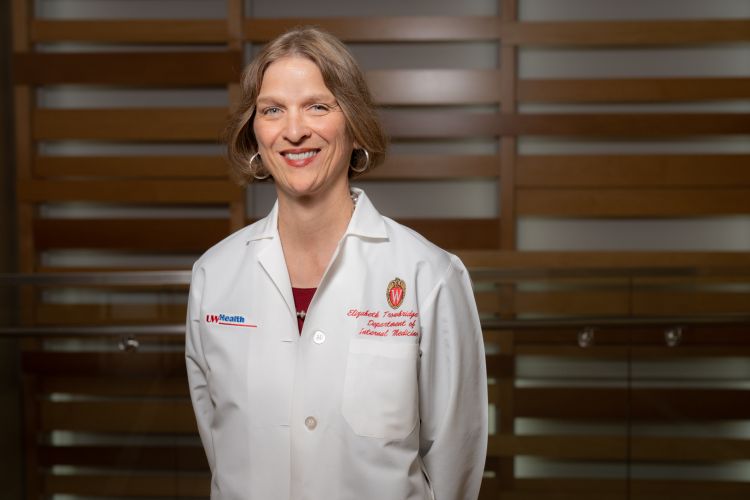 Dr. Trowbridge wearing a white coat.