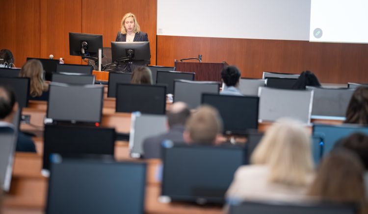 Dr. Westyn Branch-Elliman talking to a lecture hall.